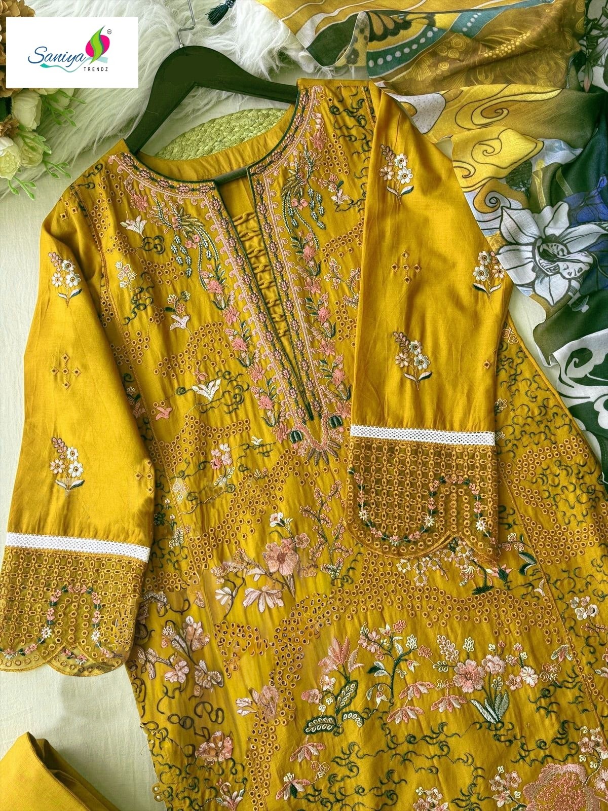 Shop SANIYA TRENDZ 7182 C with Cotton Chikankari embroidered top, Cotton Payal Bunches bottom and Maslin printed dupatta at ₹999/-.